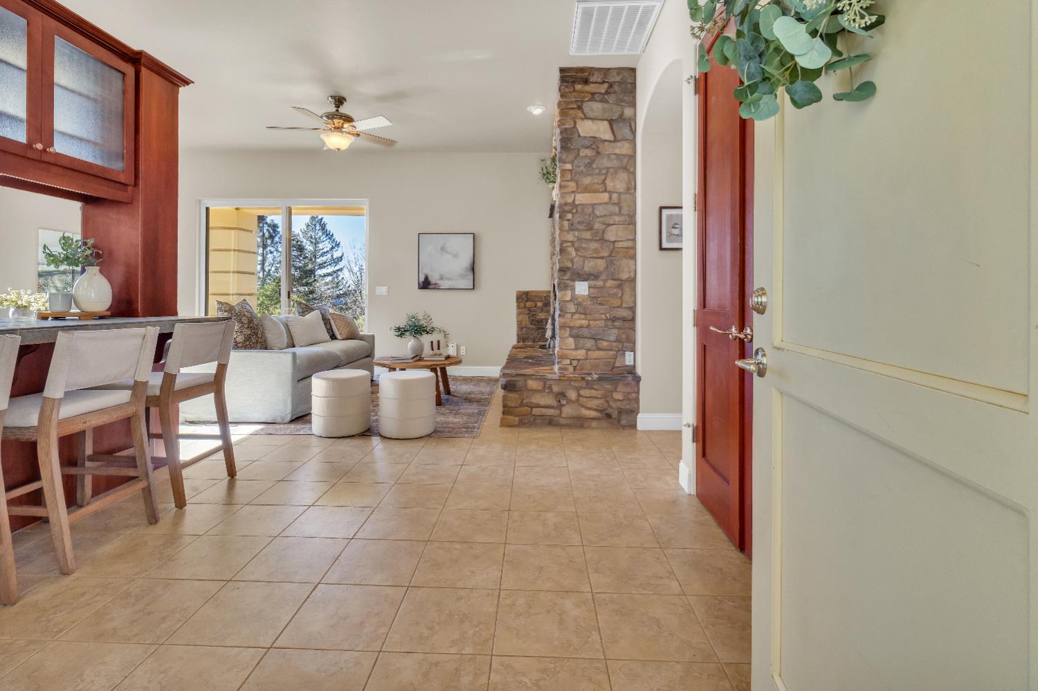 34275 Canyon View Court Alta, CA 95701 - Photo 10 of 35 a living room with furniture a chandelier and a window