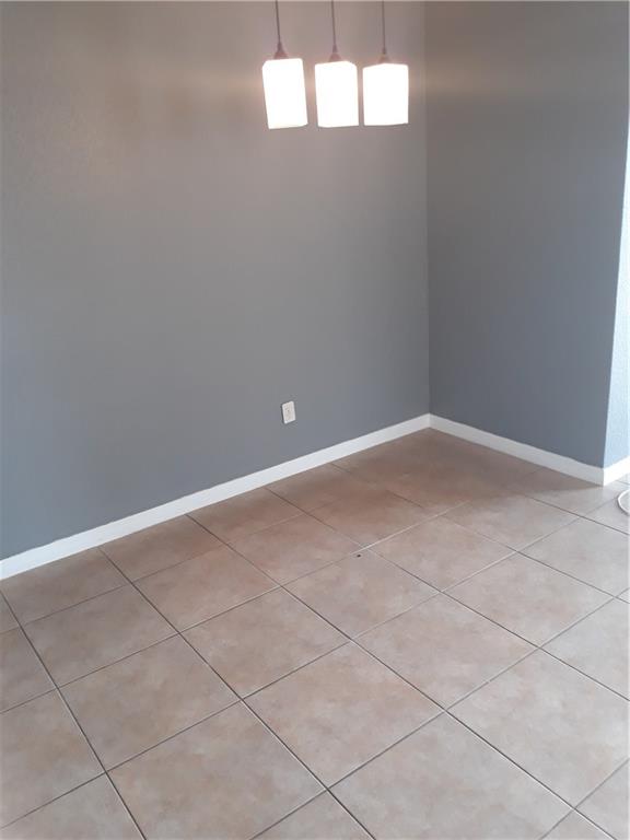 9082 Plymouth Place, Unit 9082 Tamarac, FL 33321 - Photo 20 of 47 a view of an empty room with a window