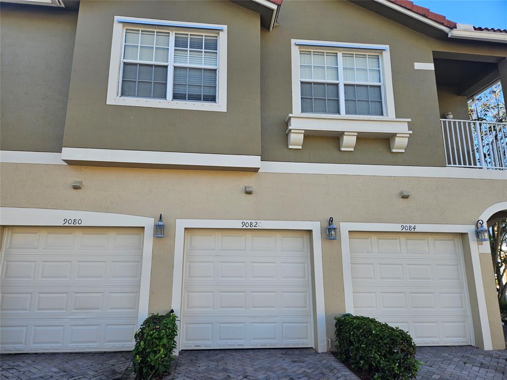 9082 Plymouth Place, Unit 9082 Tamarac, FL 33321 - Photo 2 of 47 a front view of a house