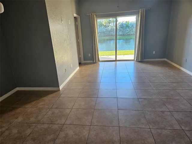 a view of an empty room and window