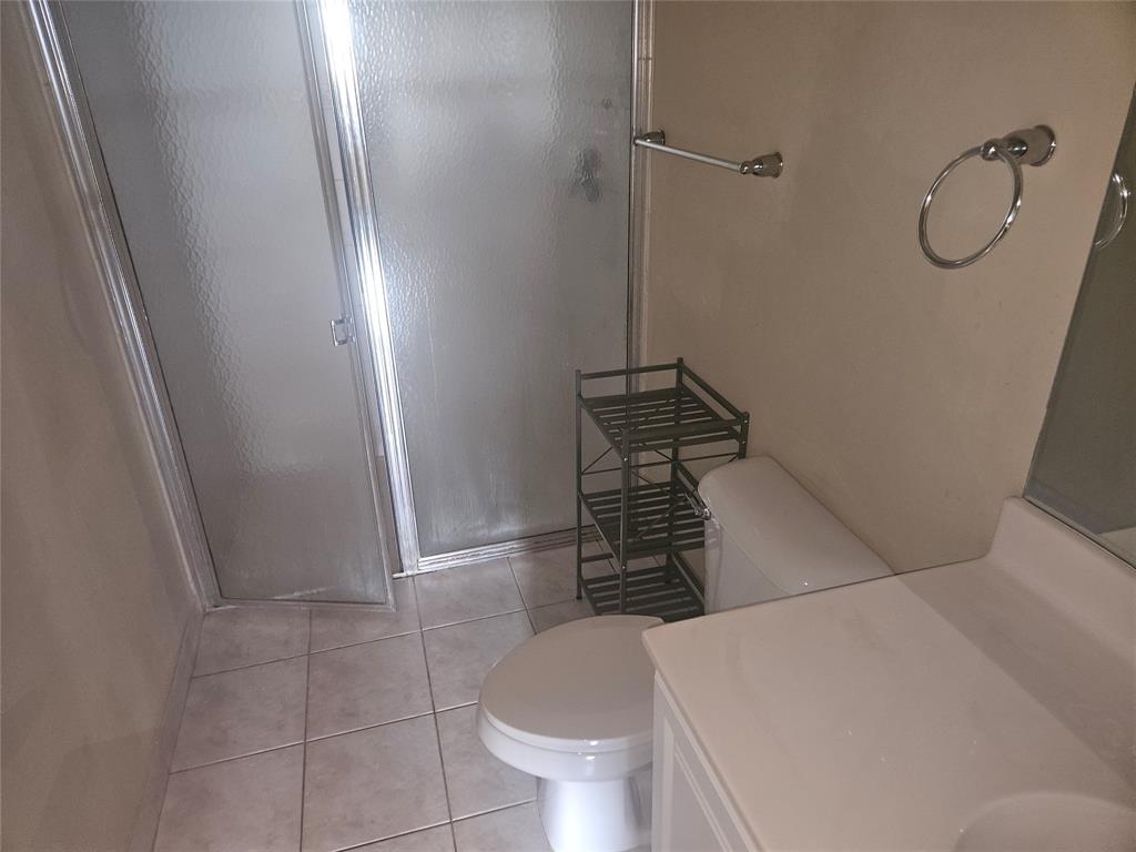 9082 Plymouth Place, Unit 9082 Tamarac, FL 33321 - Photo 35 of 47 a bathroom with a toilet and a shower