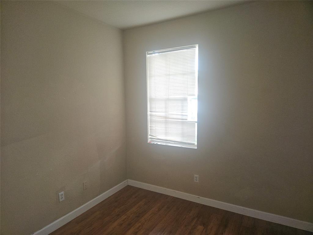 9082 Plymouth Place, Unit 9082 Tamarac, FL 33321 - Photo 40 of 47 an empty room with a window