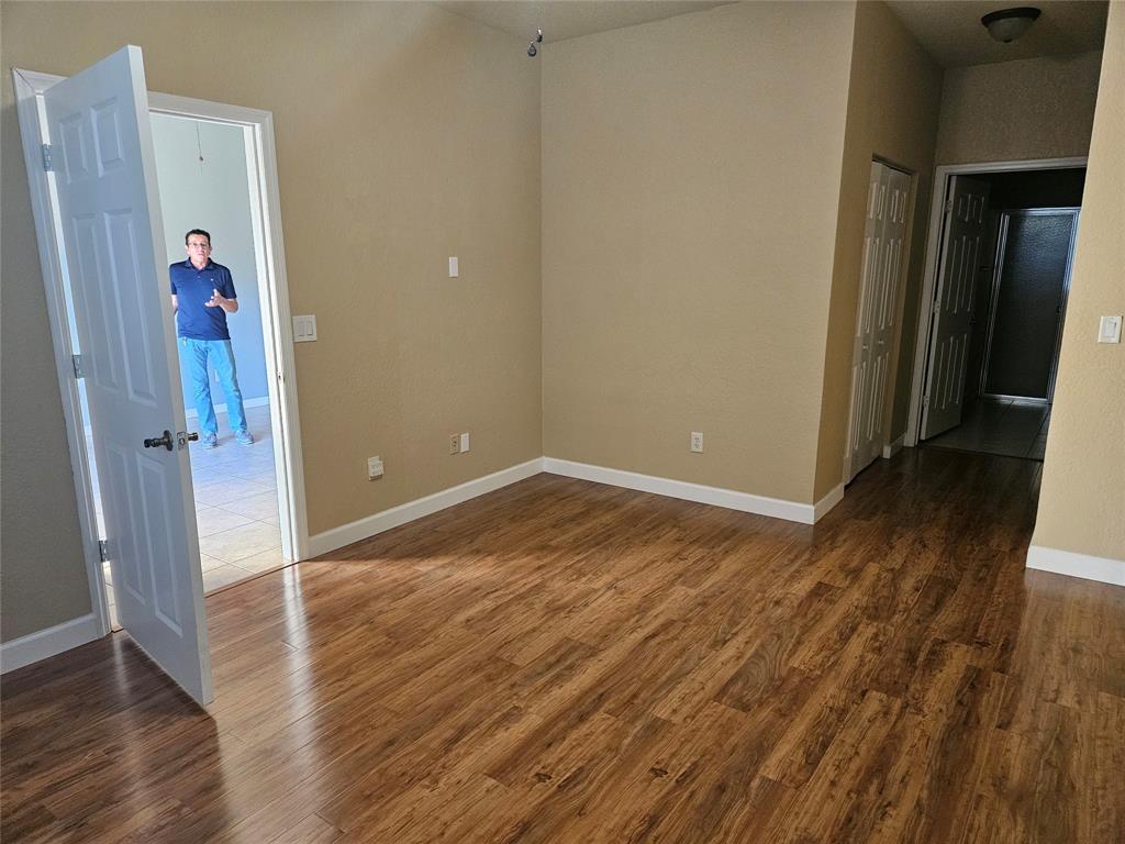 9082 Plymouth Place, Unit 9082 Tamarac, FL 33321 - Photo 6 of 47 wooden floor in an empty room