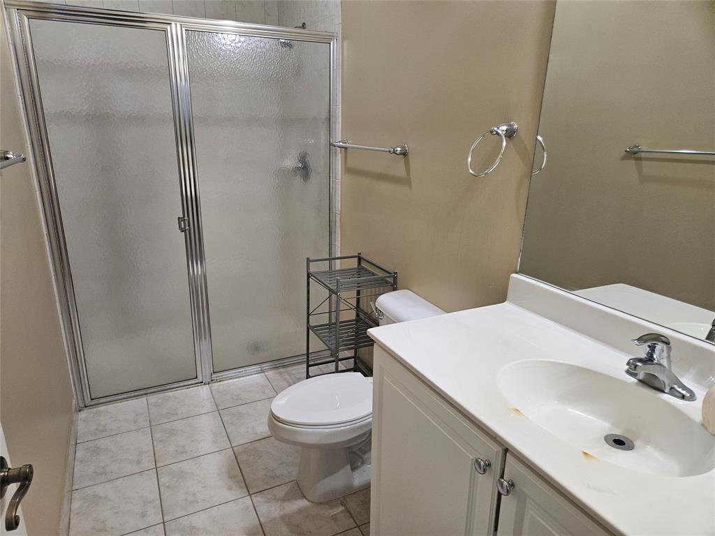 9082 Plymouth Place, Unit 9082 Tamarac, FL 33321 - Photo 8 of 47 a bathroom with a sink toilet and shower