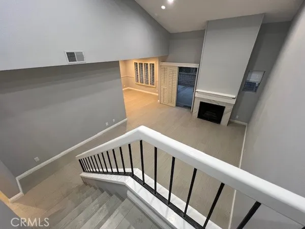 a view of a hallway with seating area