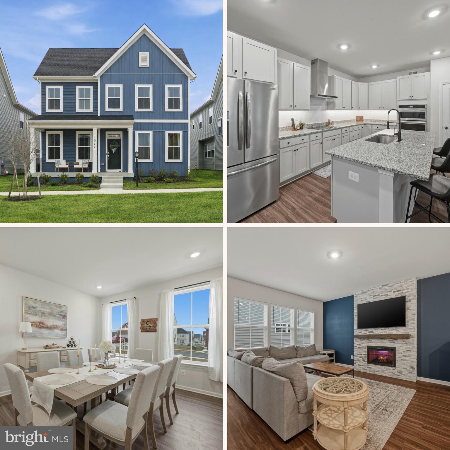 a view of a living room and kitchen with stainless steel appliances