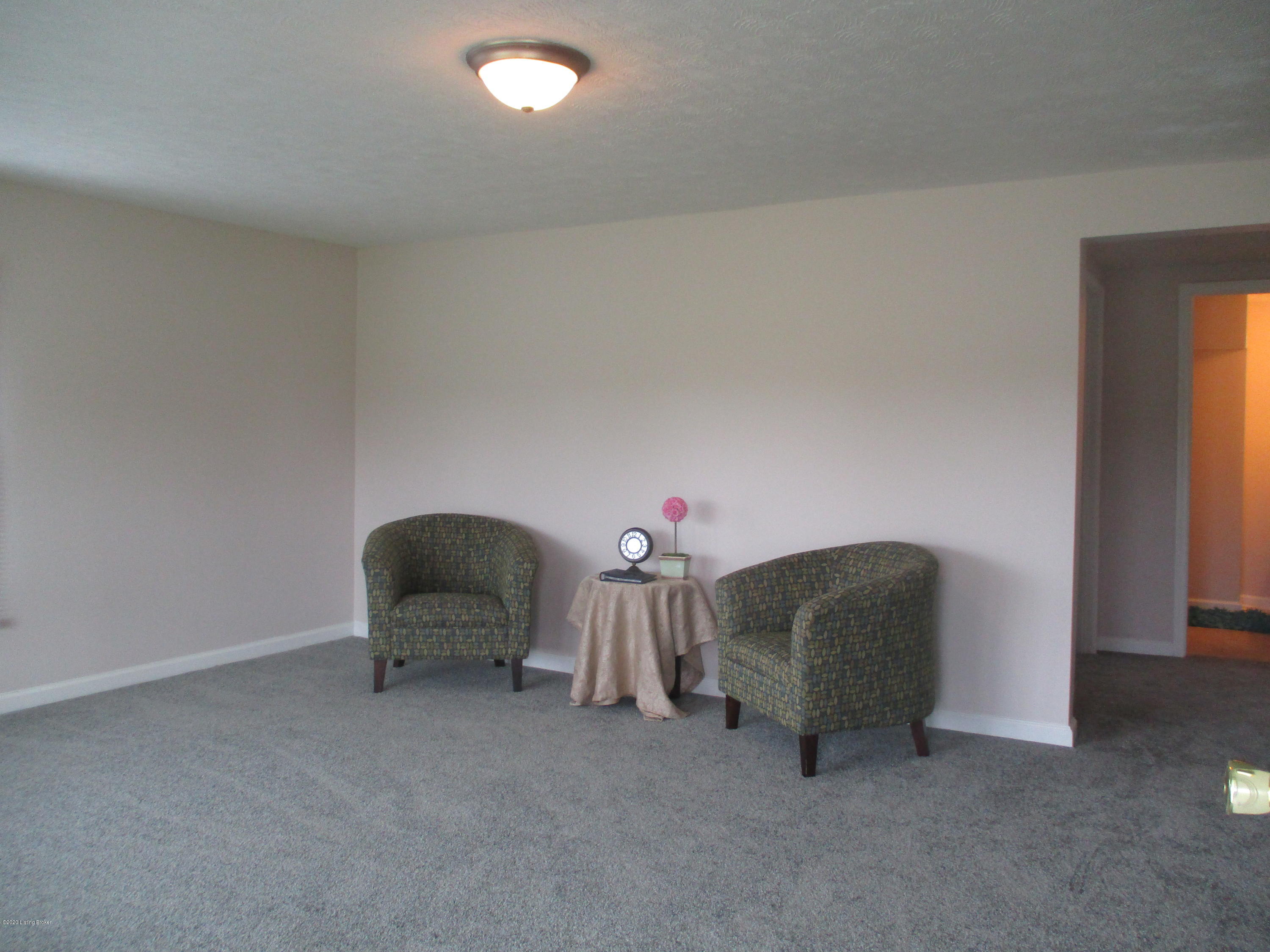 Large Living Room plenty of space for a sectional or larger furniture. Picture Window for extra sunlight, New Carpet, Paint and lighting.