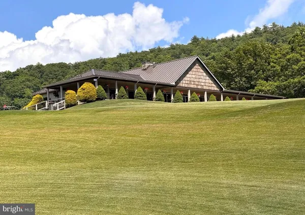 a front view of a house with a ocean view