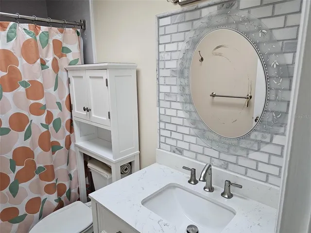 a bathroom with a shower and a bath tub