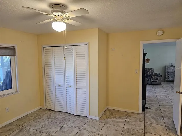 a bathroom with a sink a toilet and shower curtain