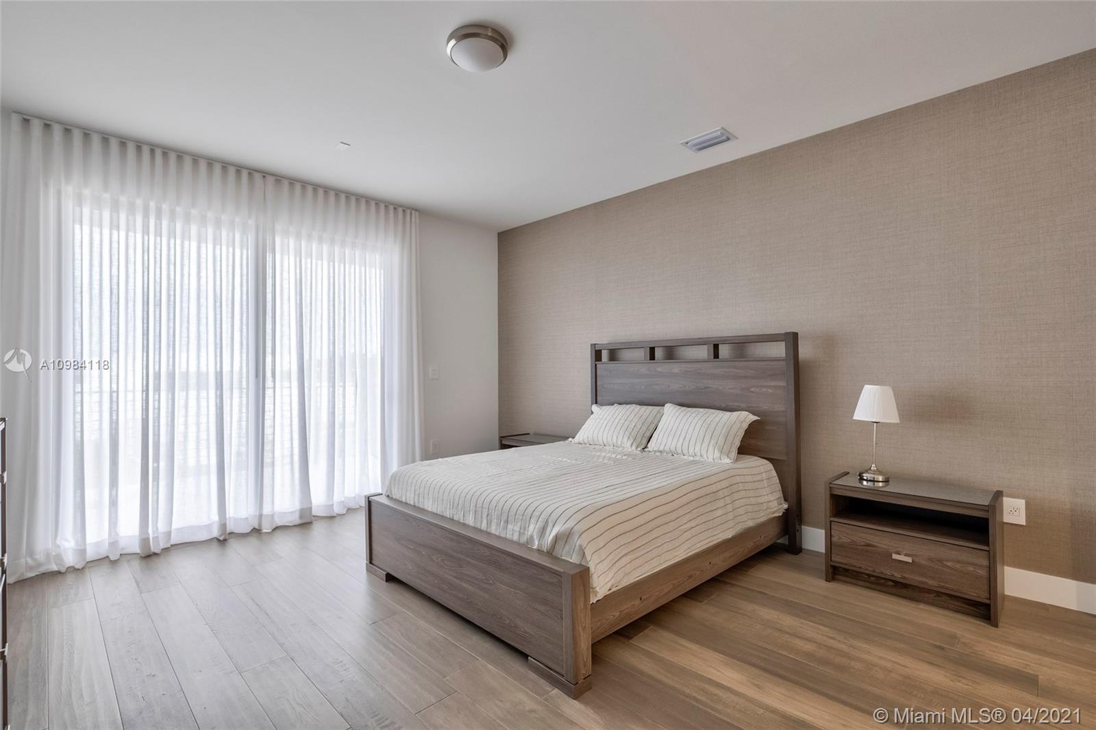 16610 Sunset Way Weston, FL 33326 - Photo 11 of 55 a bedroom with a bed and a window