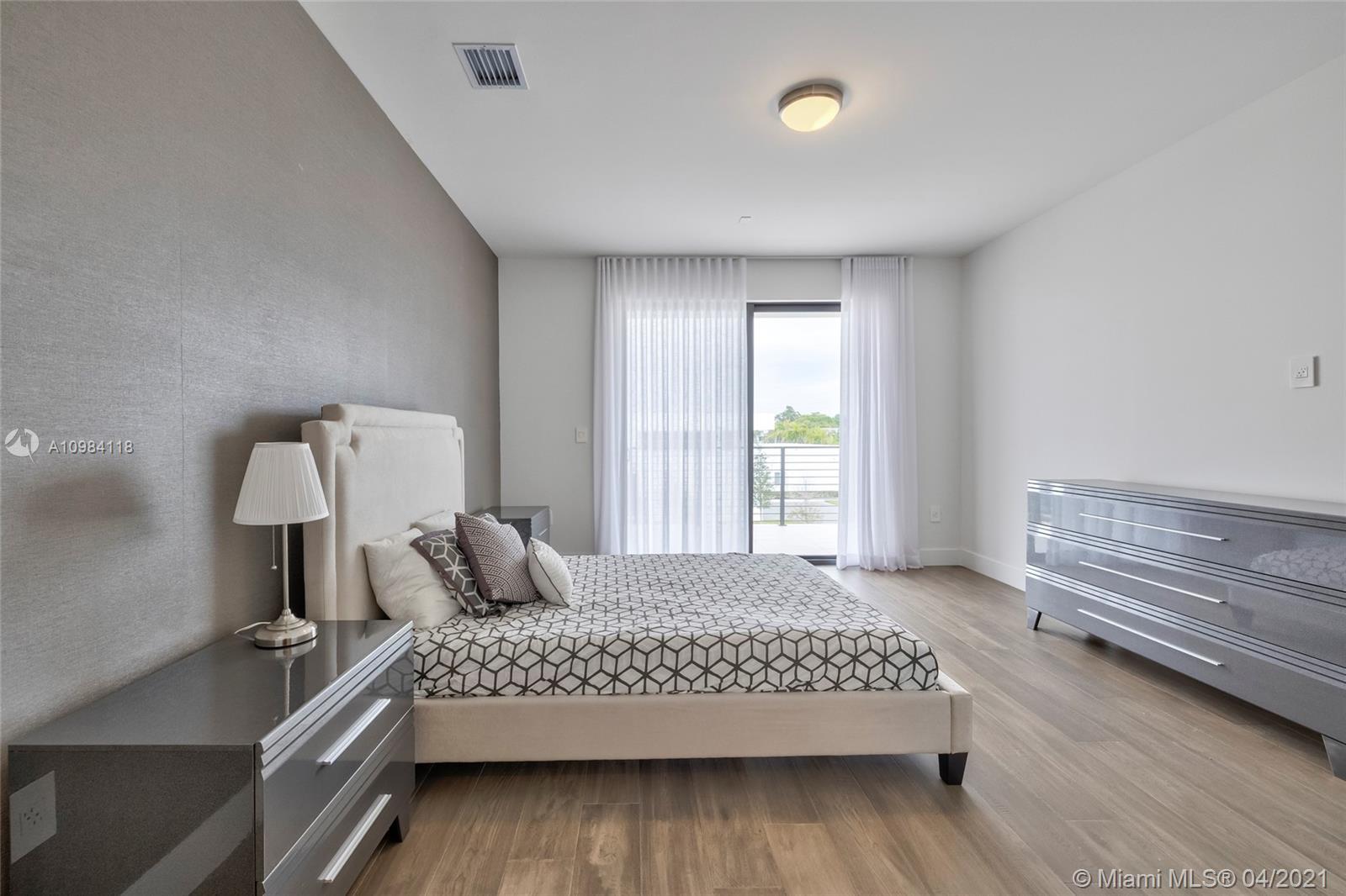 16610 Sunset Way Weston, FL 33326 - Photo 15 of 55 a bedroom with a bed and window