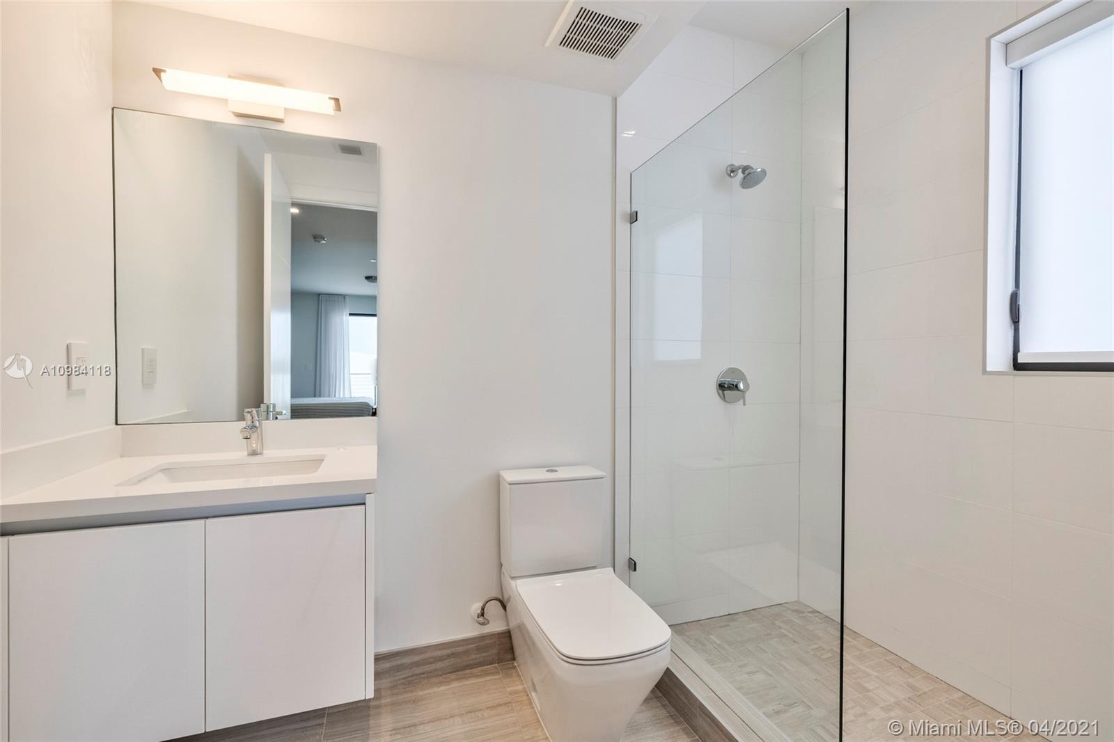 16610 Sunset Way Weston, FL 33326 - Photo 17 of 55 a bathroom with a toilet sink and shower