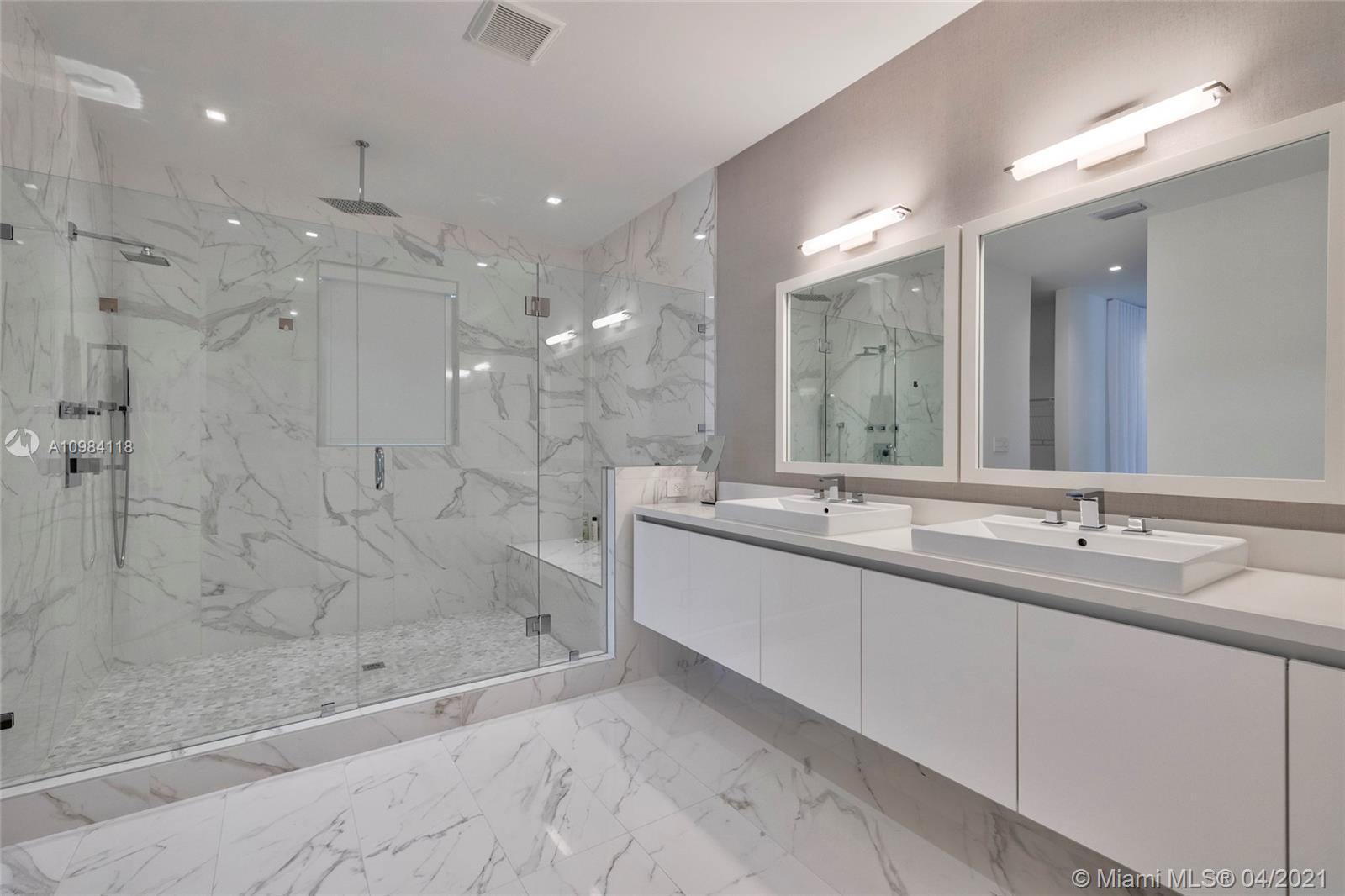 16610 Sunset Way Weston, FL 33326 - Photo 24 of 55 a bathroom with a double vanity sink mirror and shower