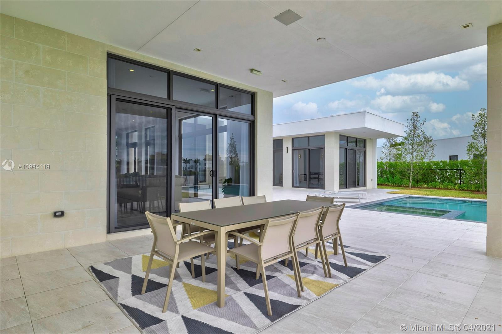 16610 Sunset Way Weston, FL 33326 - Photo 28 of 55 a view of a patio with a table and chairs