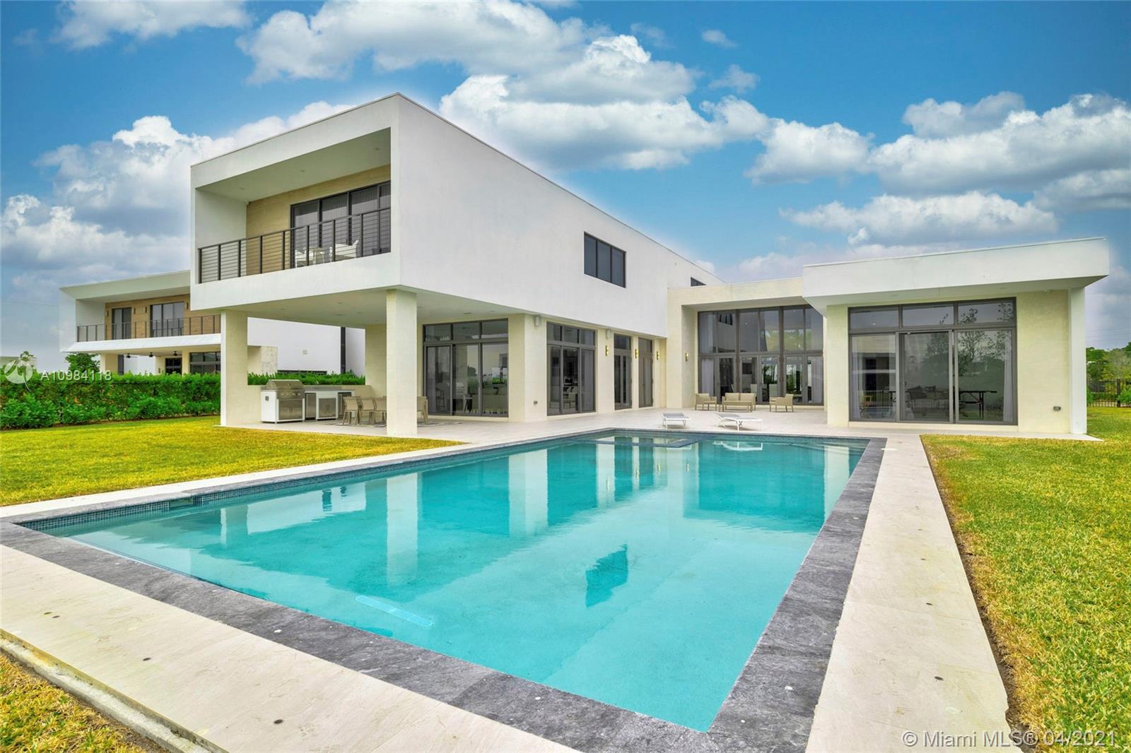 16610 Sunset Way Weston, FL 33326 - Photo 35 of 55 a view of house with swimming pool and porch