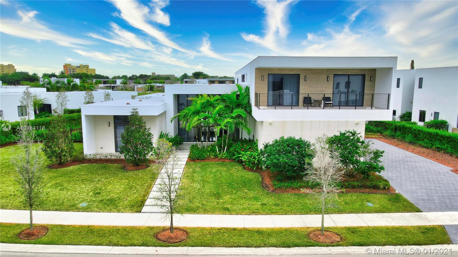 16610 Sunset Way Weston, FL 33326 - Photo 37 of 55 a front view of a house with a yard