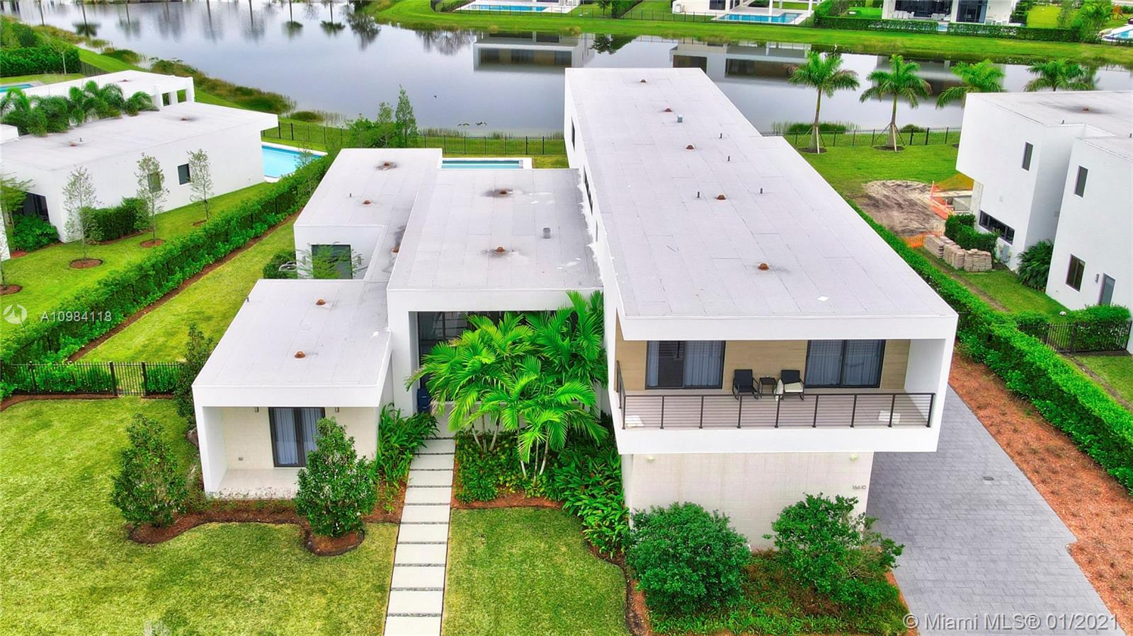16610 Sunset Way Weston, FL 33326 - Photo 38 of 55 an aerial view of a house with a garden and plants
