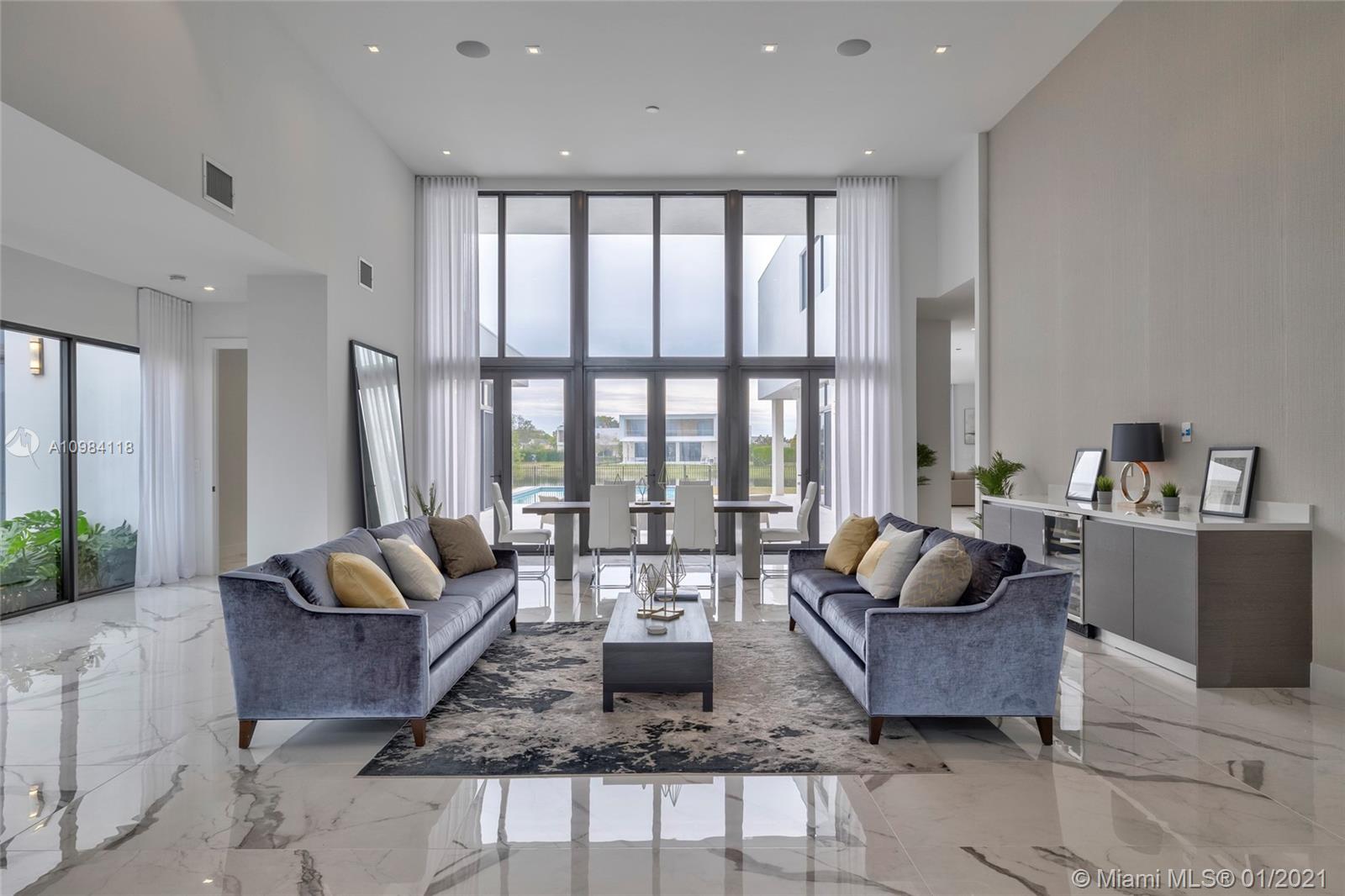 16610 Sunset Way Weston, FL 33326 - Photo 43 of 55 a living room with furniture and a large window