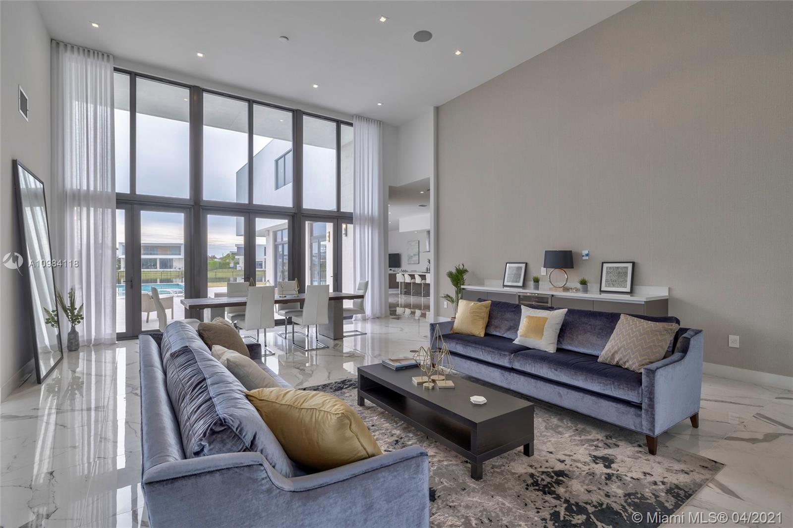 16610 Sunset Way Weston, FL 33326 - Photo 45 of 55 a living room with furniture and a large window