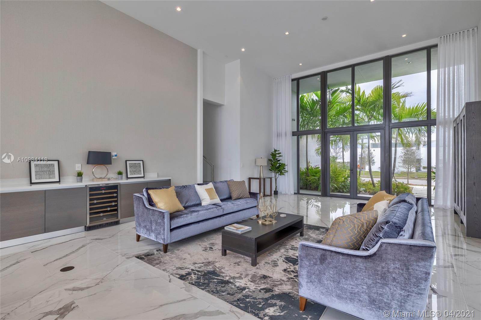 16610 Sunset Way Weston, FL 33326 - Photo 46 of 55 a living room with furniture and large windows