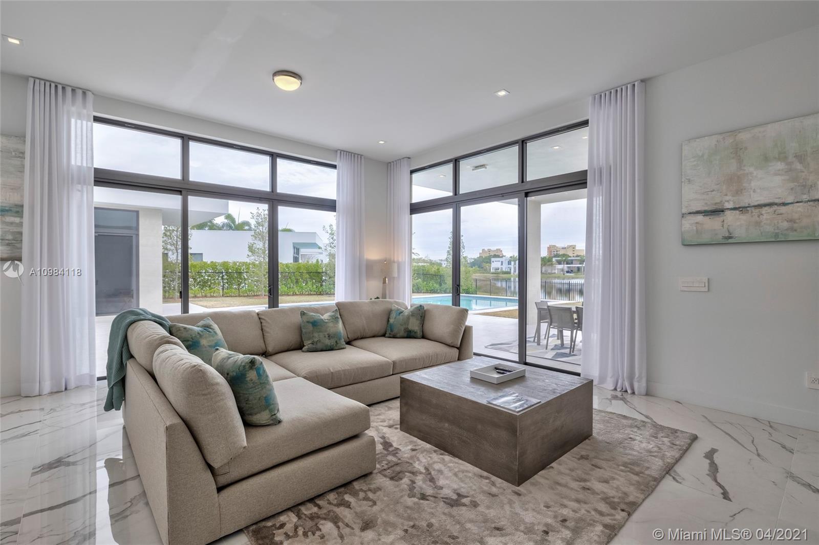16610 Sunset Way Weston, FL 33326 - Photo 54 of 55 a living room with furniture and a large window