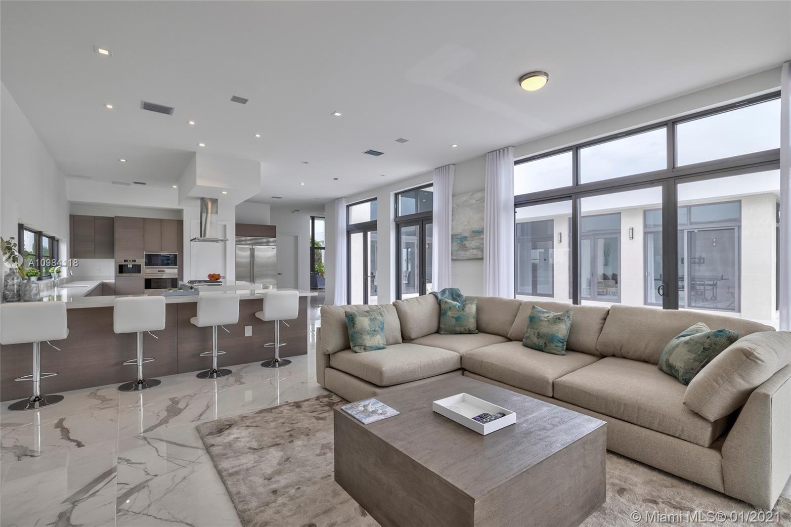 16610 Sunset Way Weston, FL 33326 - Photo 55 of 55 a living room with furniture and a large window