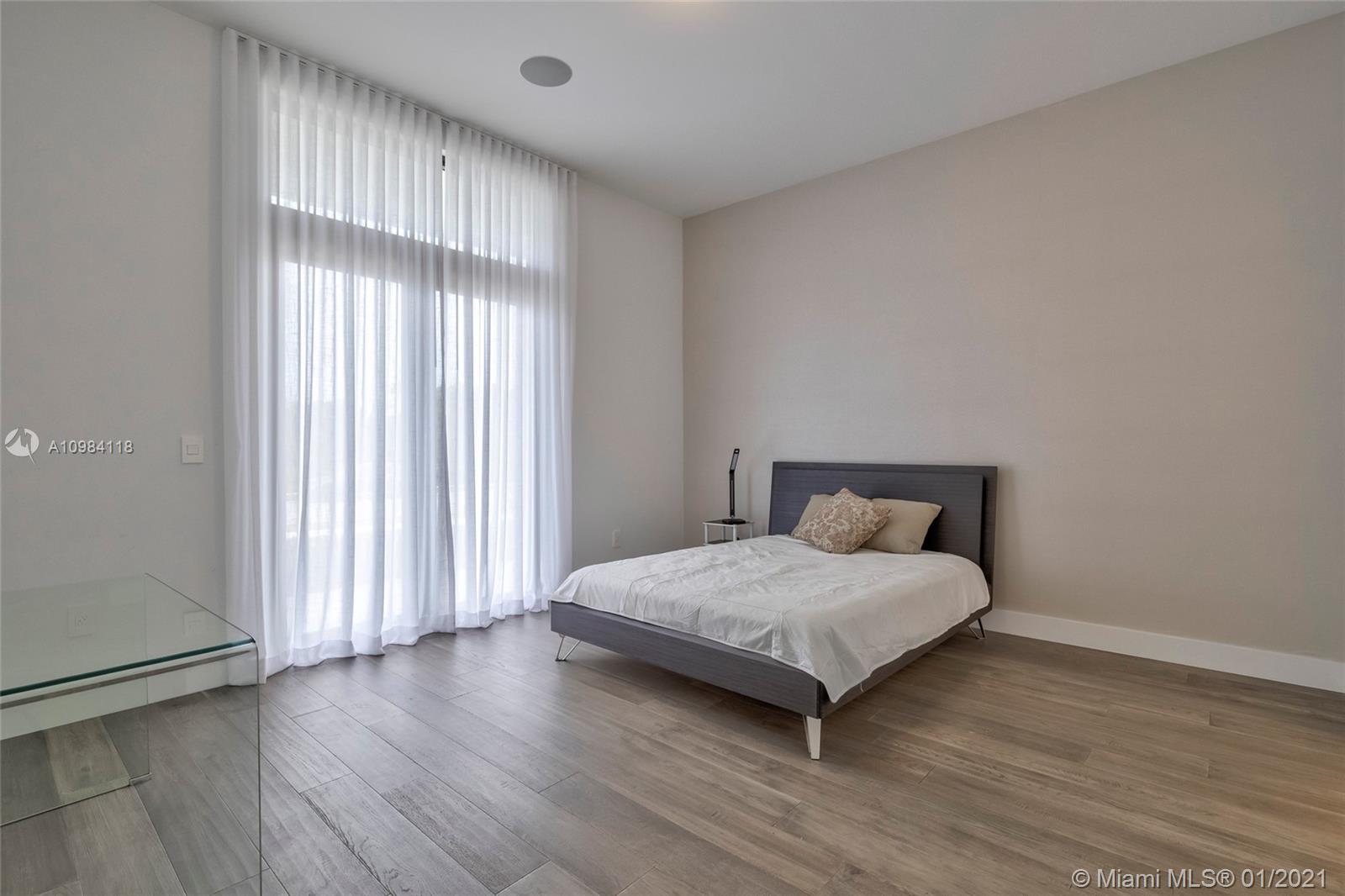 16610 Sunset Way Weston, FL 33326 - Photo 7 of 55 a bedroom with a bed and a window