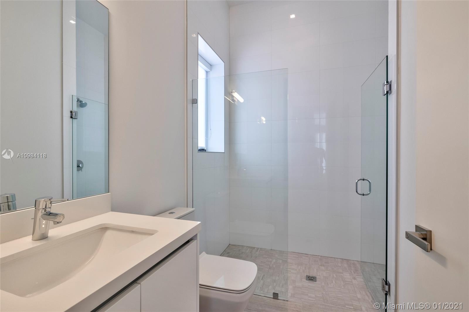 16610 Sunset Way Weston, FL 33326 - Photo 8 of 55 a bathroom with a sink a toilet and shower