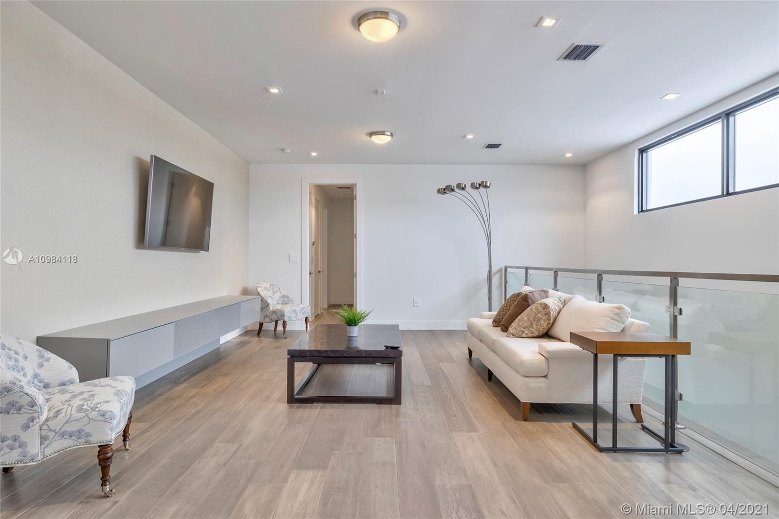 16610 Sunset Way Weston, FL 33326 - Photo 9 of 55 a living room with furniture and a wooden floor