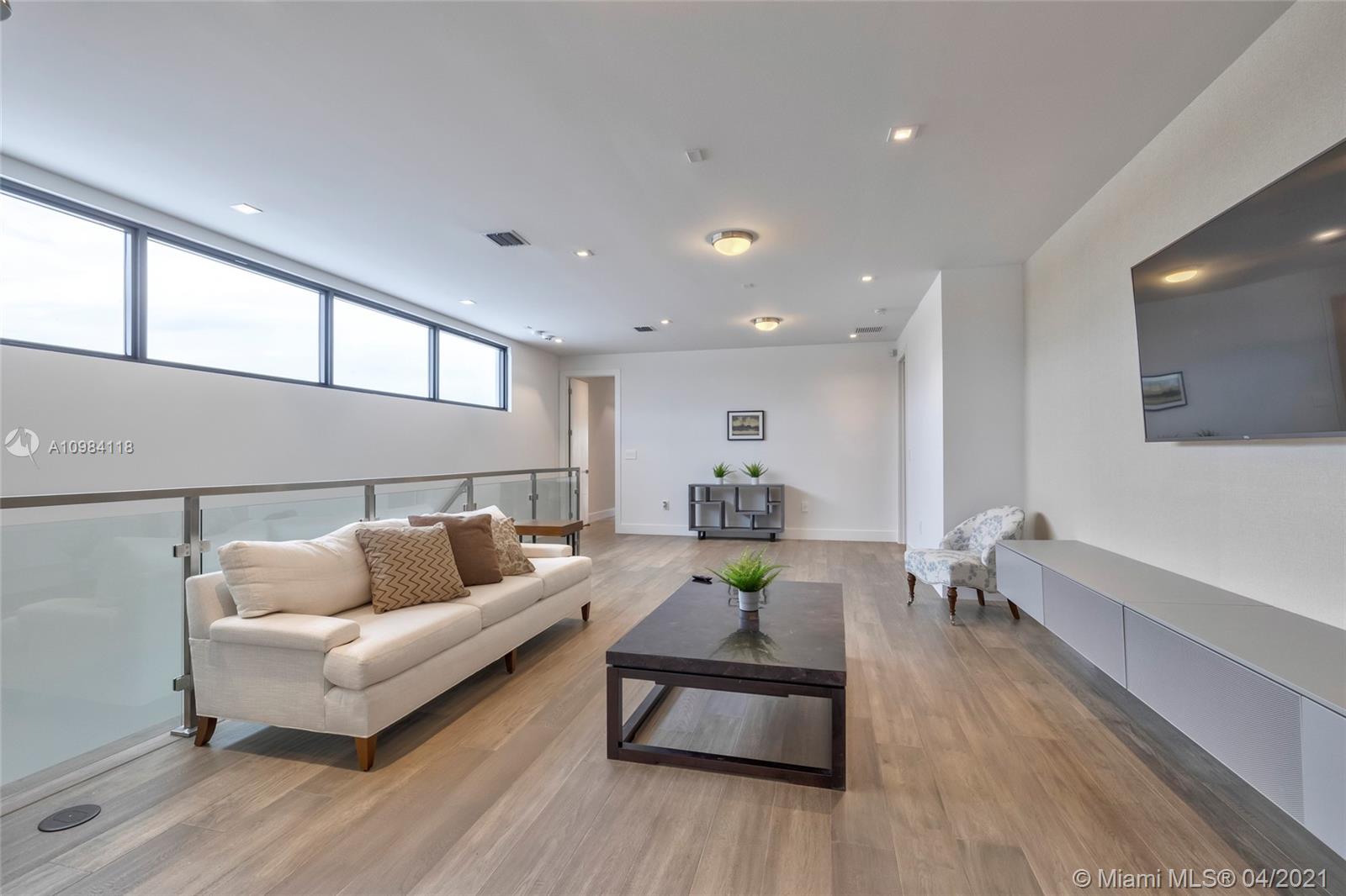 16610 Sunset Way Weston, FL 33326 - Photo 10 of 55 a living room with furniture and wooden floor