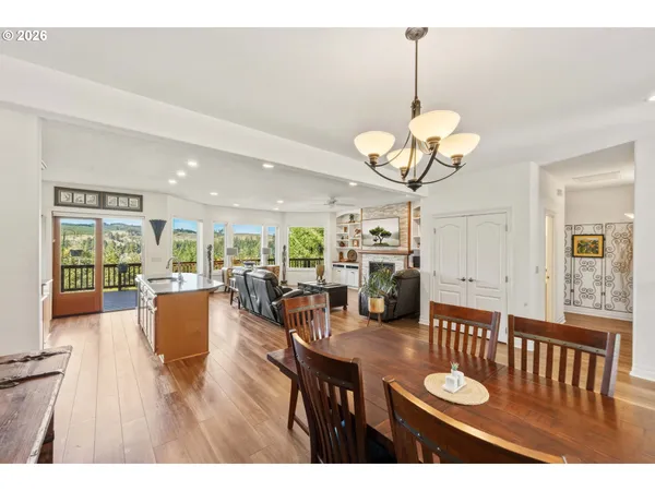 a spacious bedroom with a bed and a large window