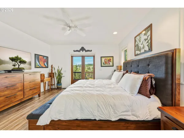 a living room with a couch and a potted plant