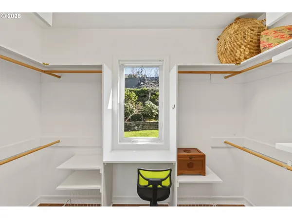 a bedroom with furniture and a window