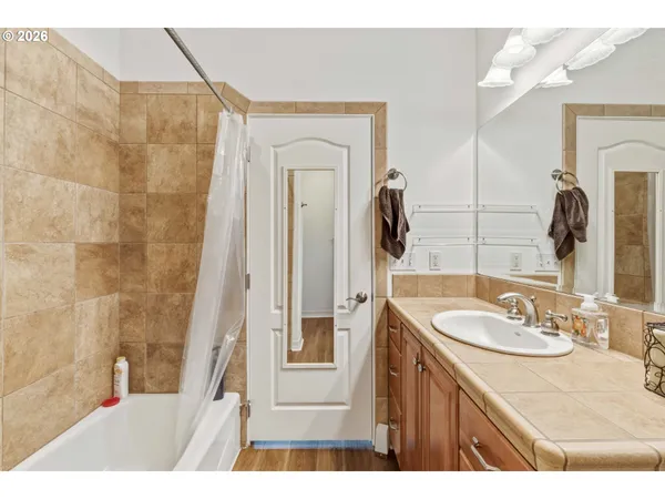 a bathroom with a sink a washer and dryer