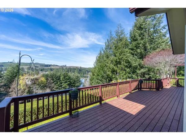 a view of a yard with wooden fence