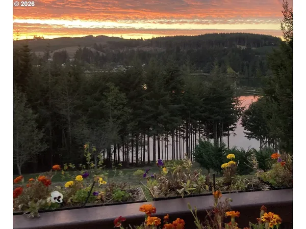 a aerial view of a house with a yard and sitting area