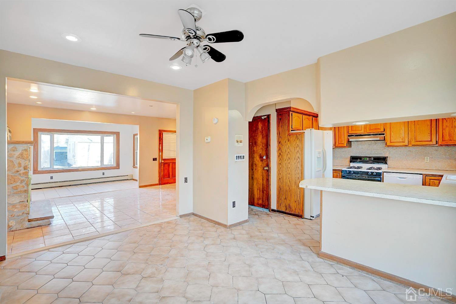 296 Argyle Place Kearny, NJ 07032 - Photo 16 of 38 a view of a kitchen with furniture and a ceiling fan