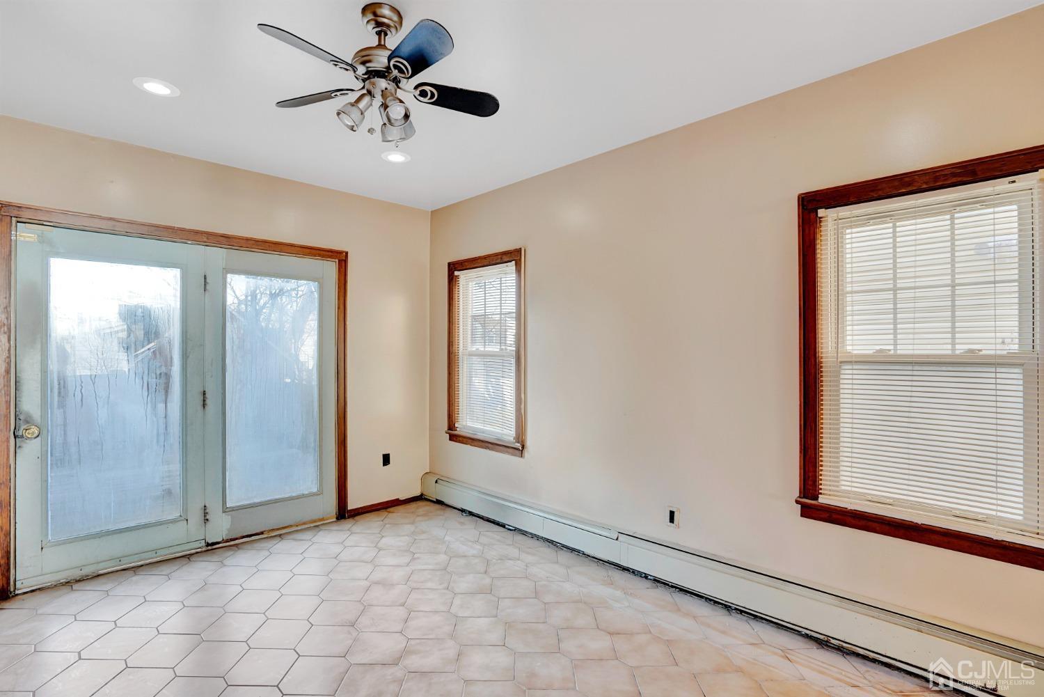 296 Argyle Place Kearny, NJ 07032 - Photo 17 of 38 a view of a livingroom with a chandelier fan and windows