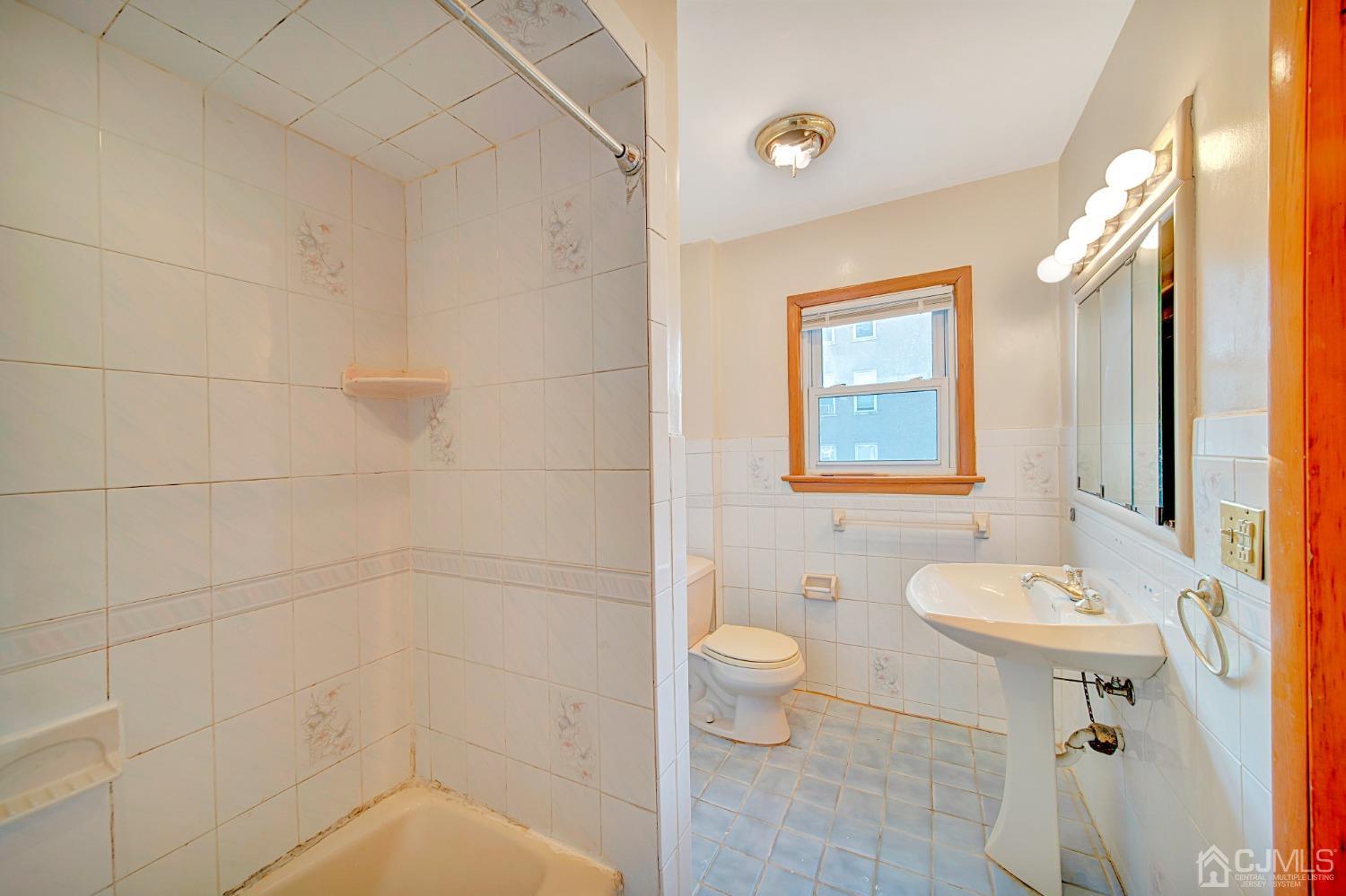 296 Argyle Place Kearny, NJ 07032 - Photo 29 of 38 a bathroom with a sink toilet and shower