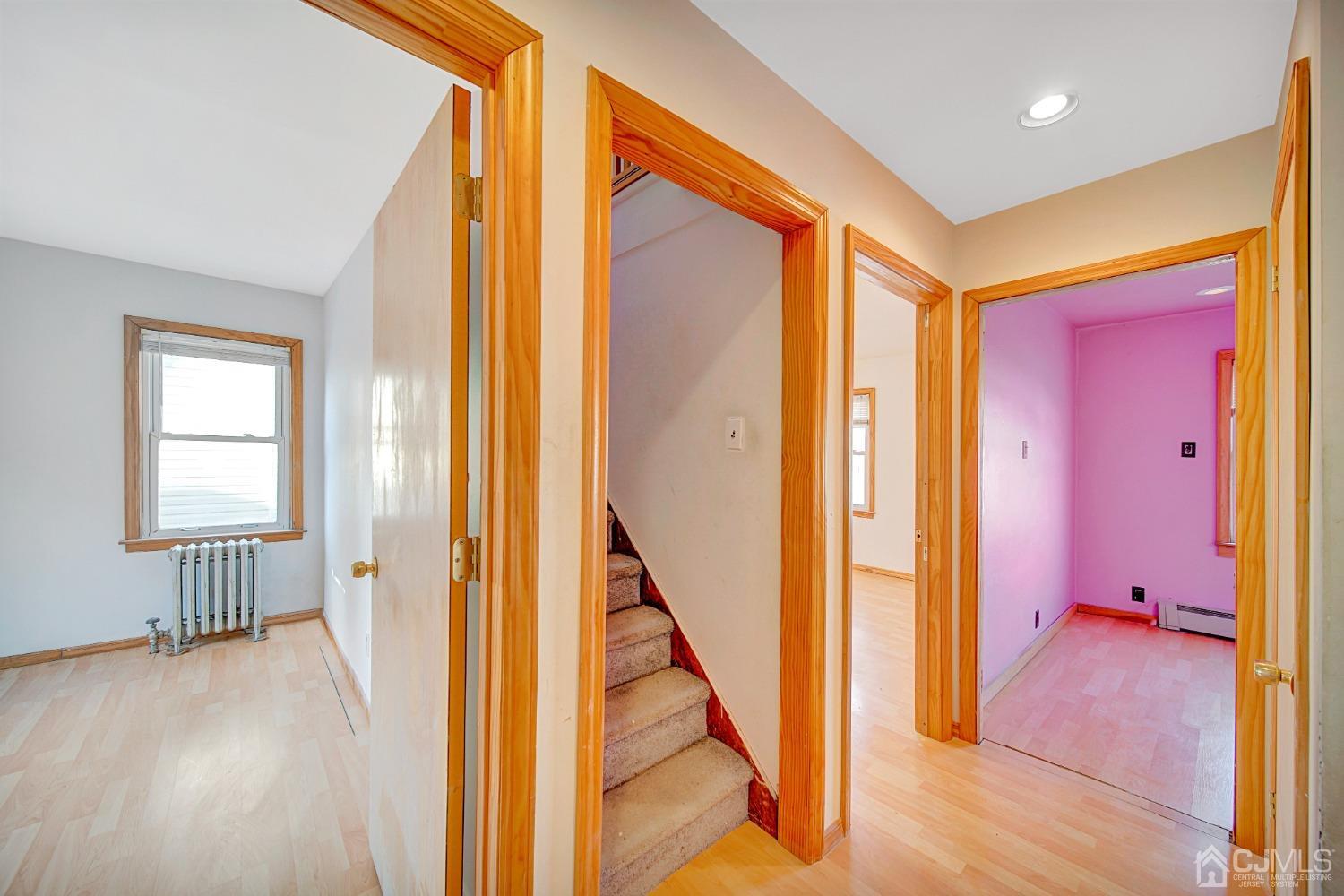 296 Argyle Place Kearny, NJ 07032 - Photo 30 of 38 a view of a hallway with wooden floor and staircase