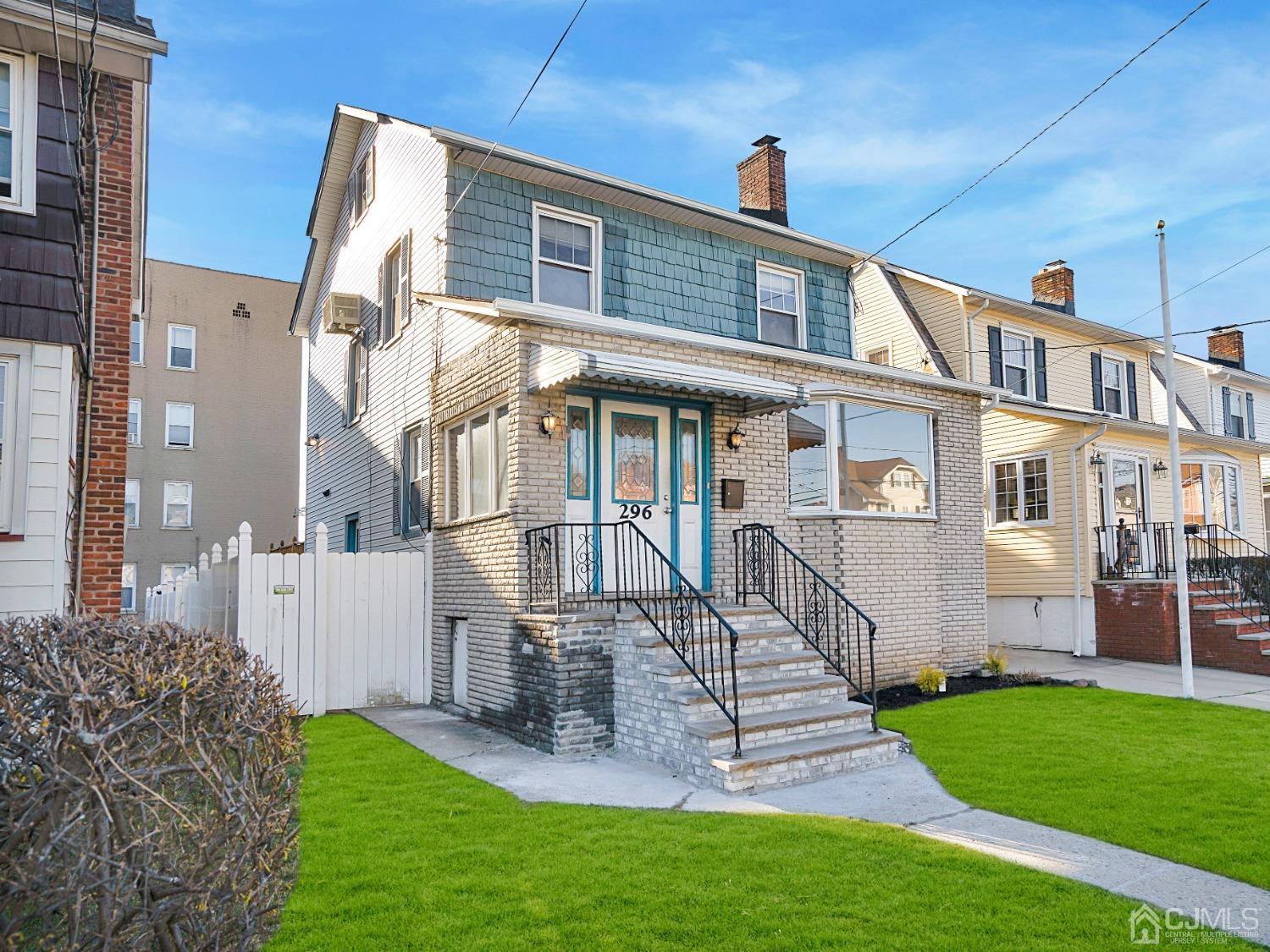 296 Argyle Place Kearny, NJ 07032 - Photo 3 of 38 a front view of a house with a garden
