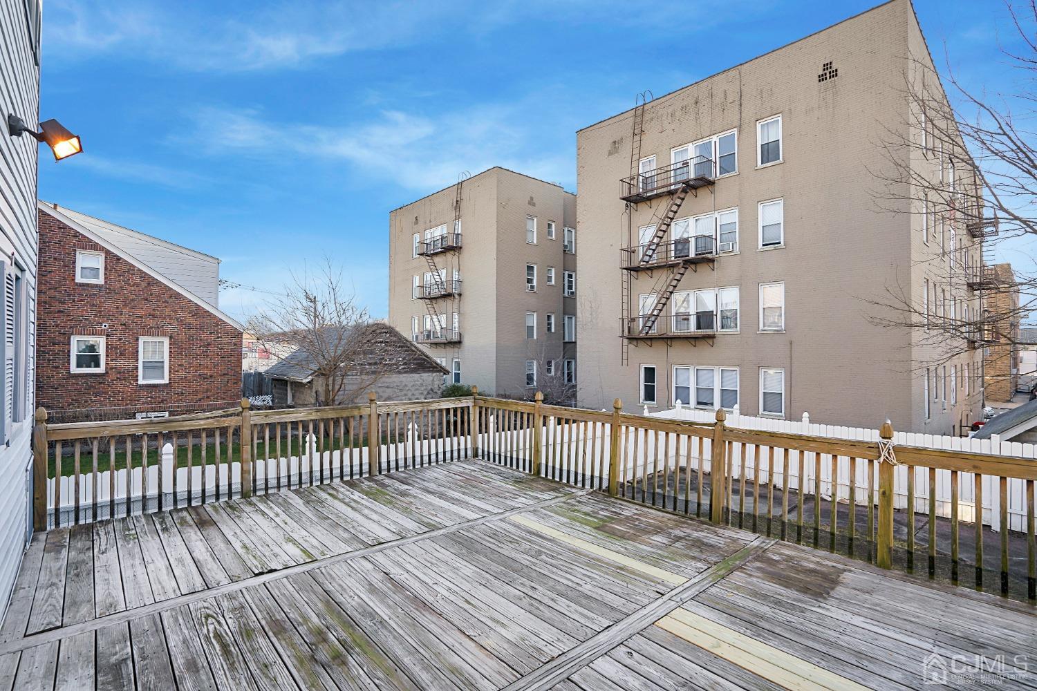 296 Argyle Place Kearny, NJ 07032 - Photo 34 of 38 a view of a brick building from a balcony