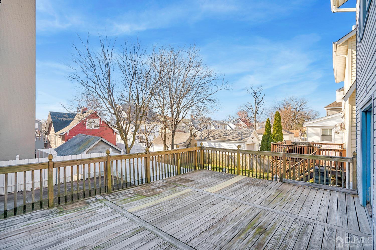 296 Argyle Place Kearny, NJ 07032 - Photo 35 of 38 a view of a wooden deck with a yard