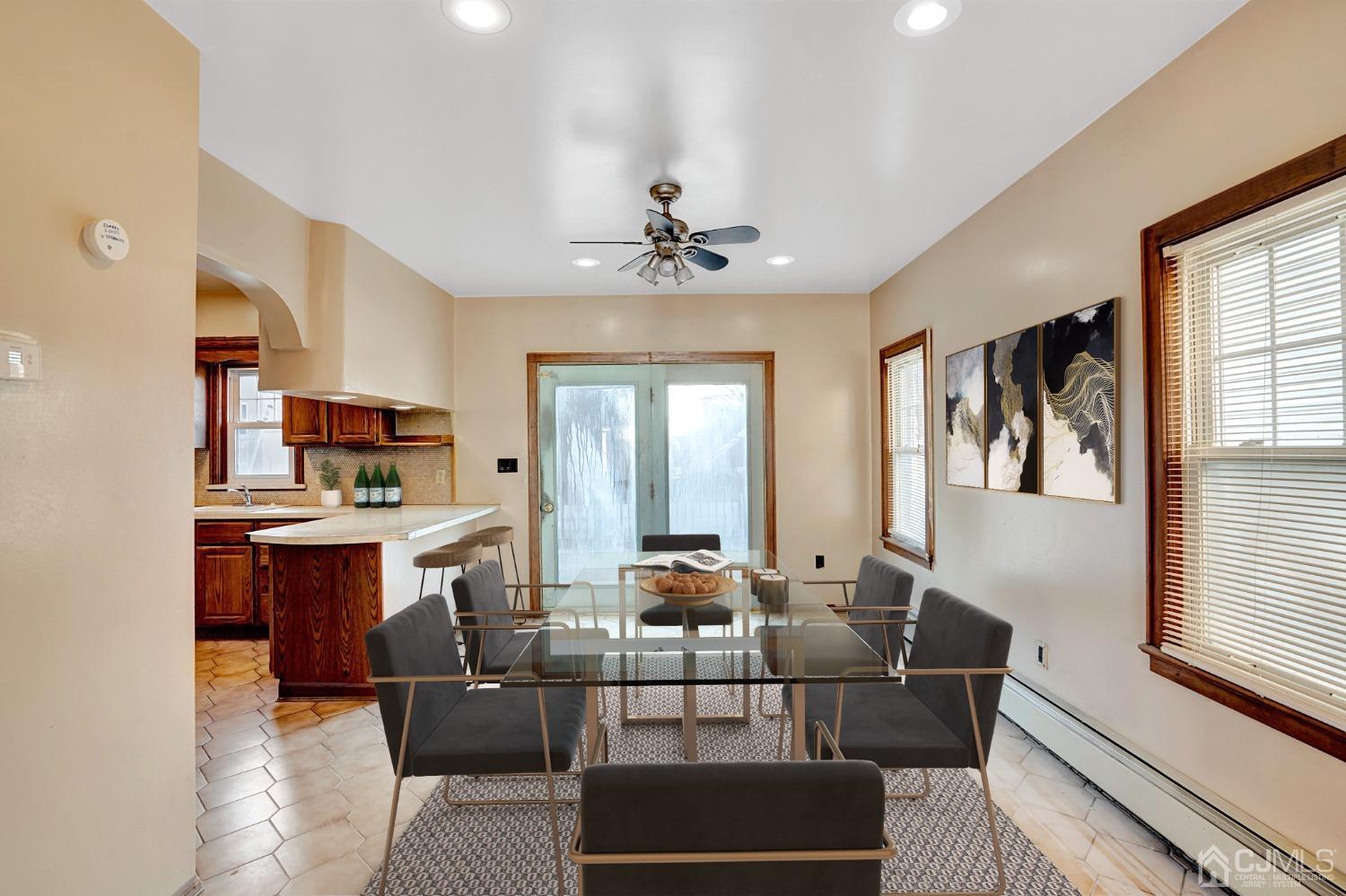 296 Argyle Place Kearny, NJ 07032 - Photo 9 of 38 a living room with stainless steel appliances kitchen island granite countertop furniture and a large window