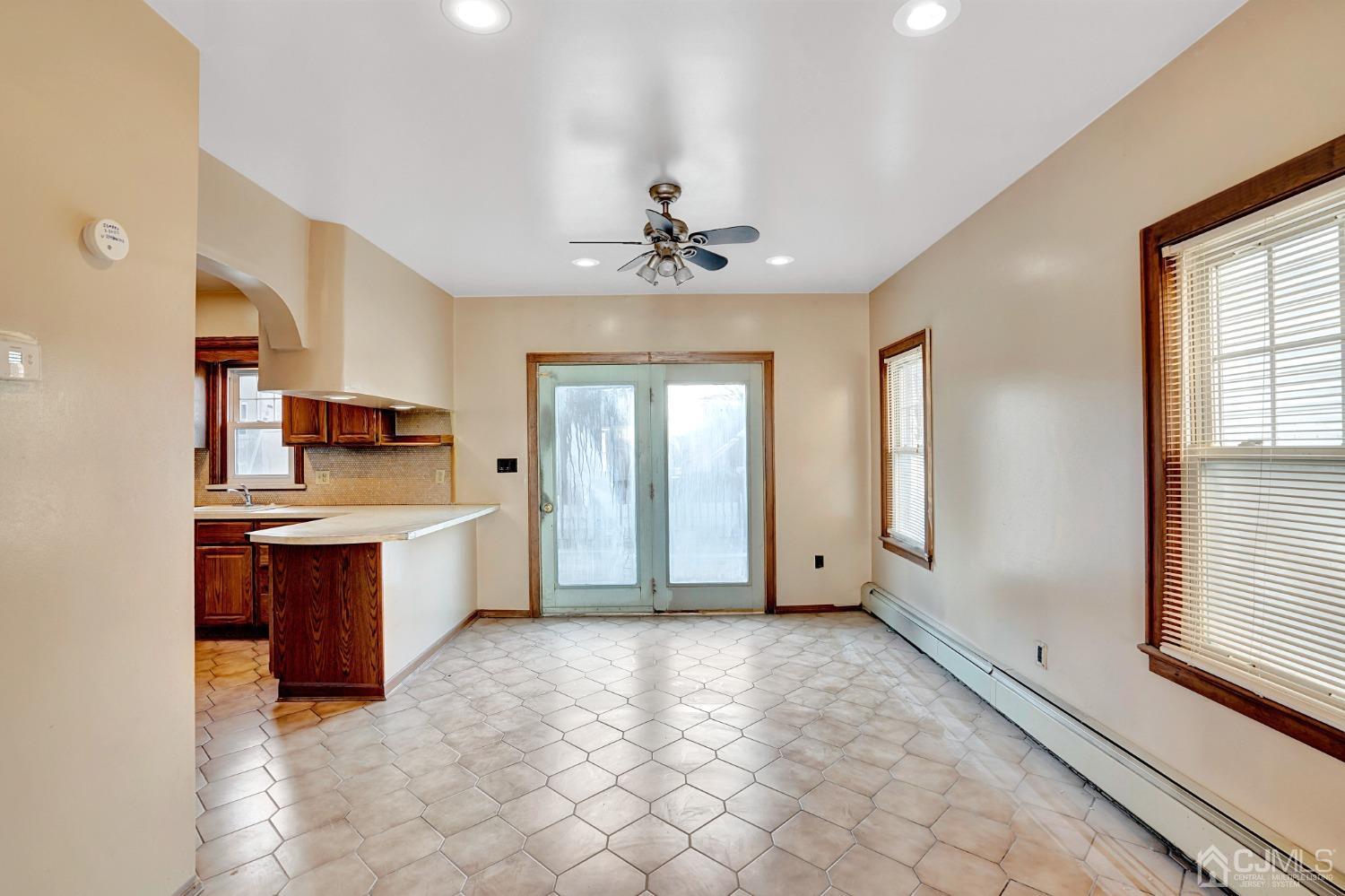 296 Argyle Place Kearny, NJ 07032 - Photo 10 of 38 a spacious bathroom with a granite countertop sink a mirror and a bathtub