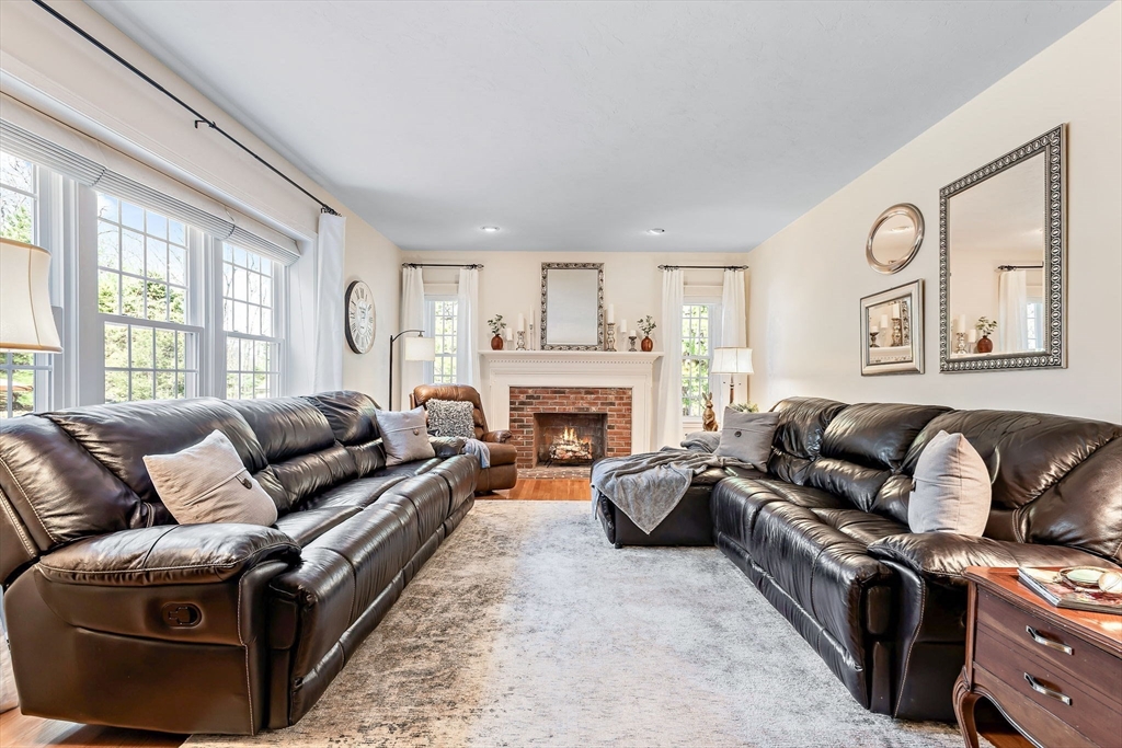 23 Northern Spy Road Franklin, MA 02038 - Photo 17 of 41 a living room with furniture and a fireplace