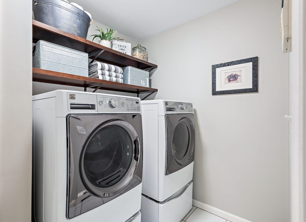 23 Northern Spy Road Franklin, MA 02038 - Photo 19 of 41 a view of a storage and utility room with washer and dryer