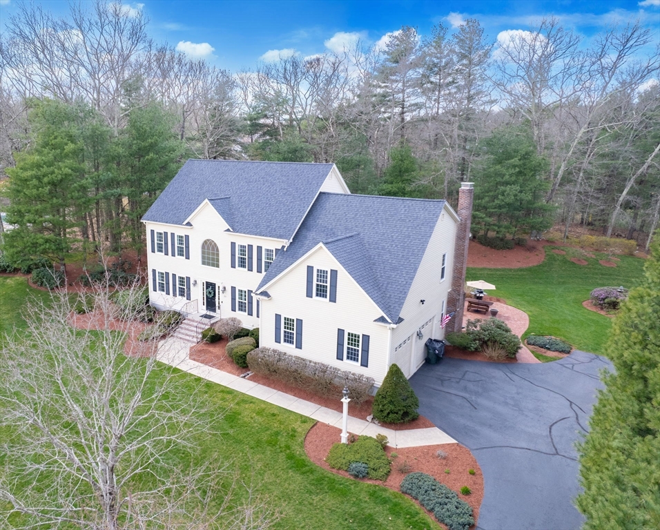 23 Northern Spy Road Franklin, MA 02038 - Photo 2 of 41 a aerial view of a house with swimming pool and garden