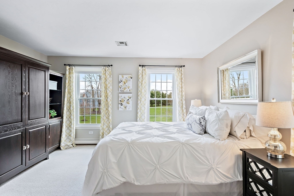 23 Northern Spy Road Franklin, MA 02038 - Photo 21 of 41 a bedroom with a bed and large windows